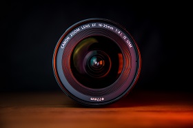 camera lens on wood table