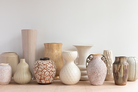 ceramic beige vases in varying sizes and colors