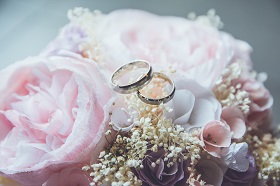 white and light pink flowers with two rings